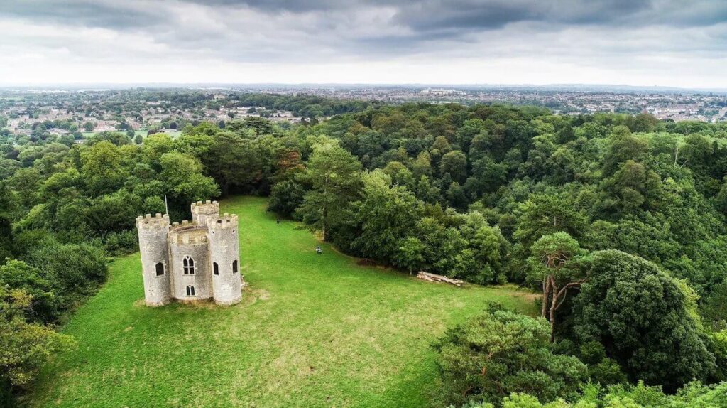Families enjoying a day out in one of Bristol's beautiful parks, Blaise Castle, surrounded by lush greenery